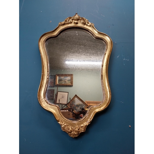 272 - French gilt and carved wall mirror in the Victorian style. {68 cm H x 40 cm W}.