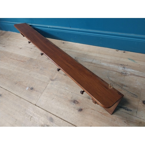 275 - 19th C. mahogany wall coat rack with hat shelf {23 cm H x 117 cm W x 14 cm D}.