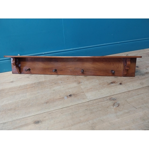 275 - 19th C. mahogany wall coat rack with hat shelf {23 cm H x 117 cm W x 14 cm D}.