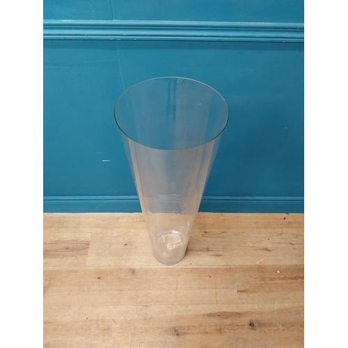 39 - Large glass flower vase {90 cm H x 28 cm Dia.}.