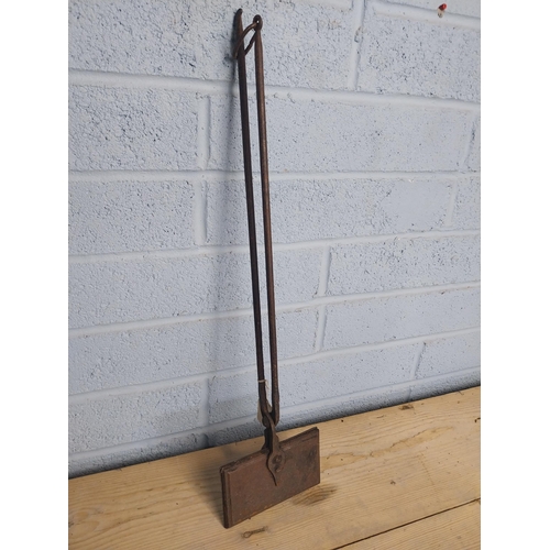 564 - Early 20th. C.  Wrought iron waffering iron  { 69cm H X 18cm W }.