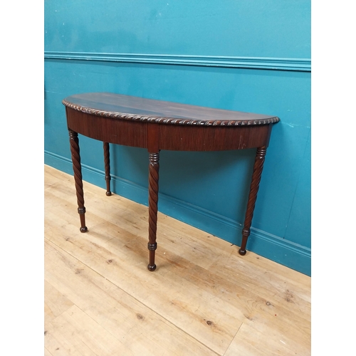 59 - Regency mahogany demi-lune side table with reeded apron raised on barley twist legs {77 cm H x 125 c... 