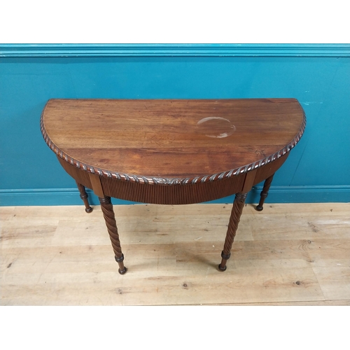 59 - Regency mahogany demi-lune side table with reeded apron raised on barley twist legs {77 cm H x 125 c... 