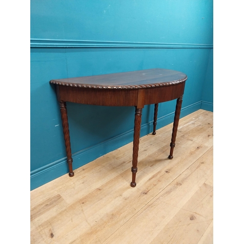 59 - Regency mahogany demi-lune side table with reeded apron raised on barley twist legs {77 cm H x 125 c... 