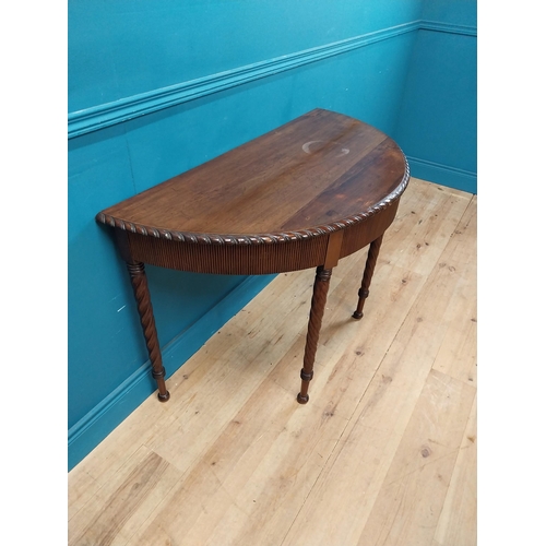 59 - Regency mahogany demi-lune side table with reeded apron raised on barley twist legs {77 cm H x 125 c... 