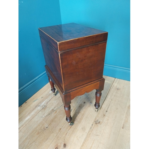 68 - Georgian mahogany cellarette raised on turned legs and castors {63 cm H x 49 cm W x 23 cm D}.