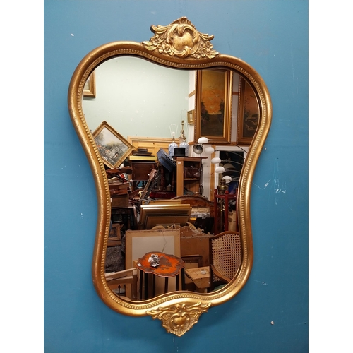 72 - Gilt and carved wall mirror in the Victorian style. {69 cm H x 47 cm W}