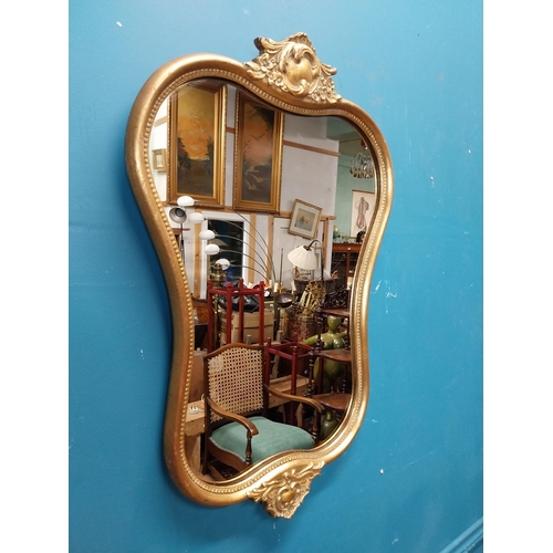 72 - Gilt and carved wall mirror in the Victorian style. {69 cm H x 47 cm W}