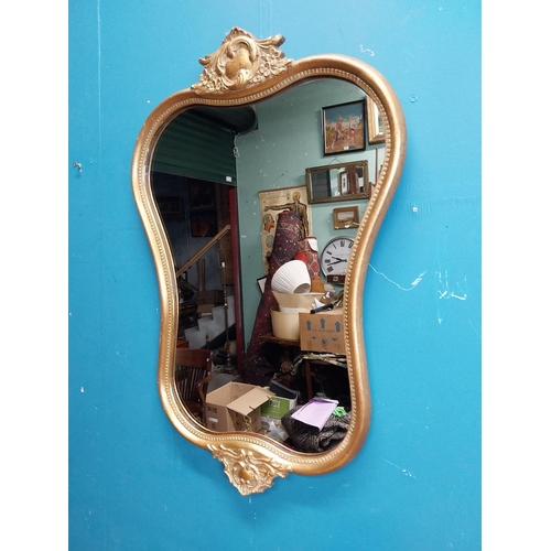 72 - Gilt and carved wall mirror in the Victorian style. {69 cm H x 47 cm W}