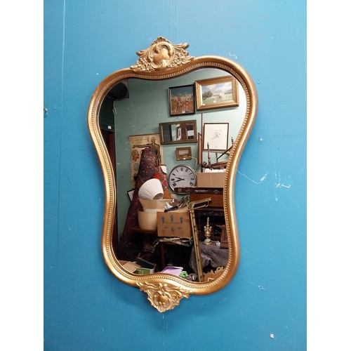 72 - Gilt and carved wall mirror in the Victorian style. {69 cm H x 47 cm W}