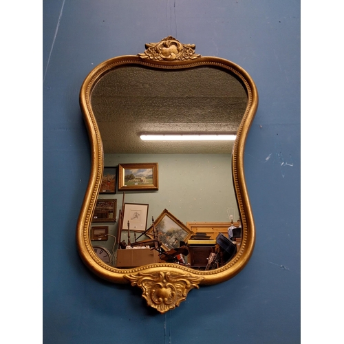 72 - Gilt and carved wall mirror in the Victorian style. {69 cm H x 47 cm W}