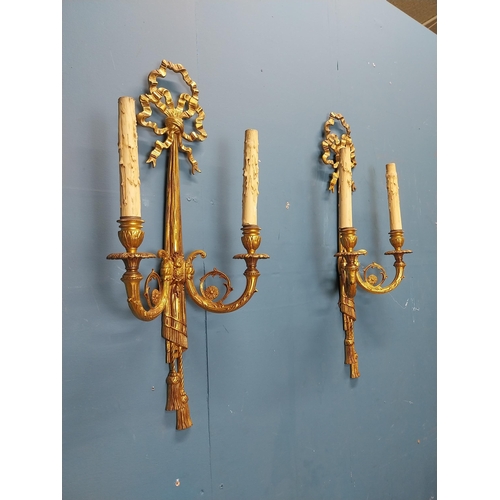 75 - Pair of good quality gilded bronze wall lights in the Empire style {60 cm H x 28 cm W x 13 cm D}.