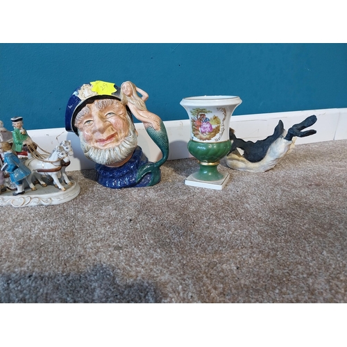 778 - Collection of ceramic figurines and jugs.{ cm H  cm W cm D}.