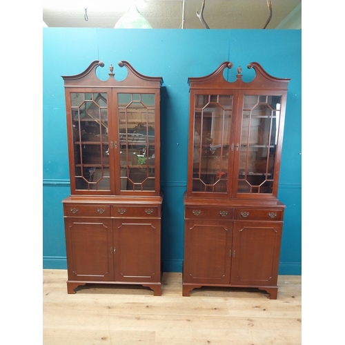 79 - Pair of good quality mahogany book cases with two astral glazed doors over two short drawers and two... 