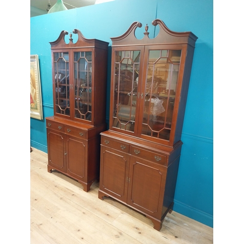 79 - Pair of good quality mahogany book cases with two astral glazed doors over two short drawers and two... 