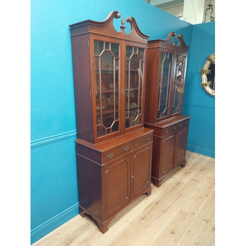 79 - Pair of good quality mahogany book cases with two astral glazed doors over two short drawers and two... 