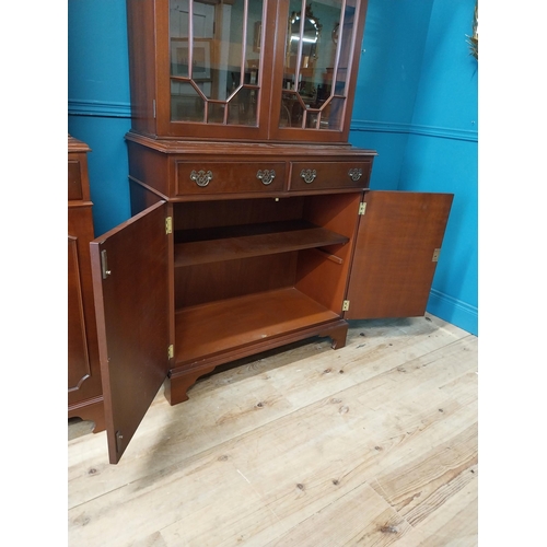 79 - Pair of good quality mahogany book cases with two astral glazed doors over two short drawers and two... 