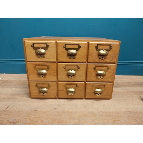 81 - 1940's oak desk top bank of drawers with original brass handles. {36 cm H x 50 cm W x 43 cm D}.