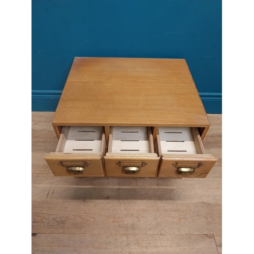 81 - 1940's oak desk top bank of drawers with original brass handles. {36 cm H x 50 cm W x 43 cm D}.