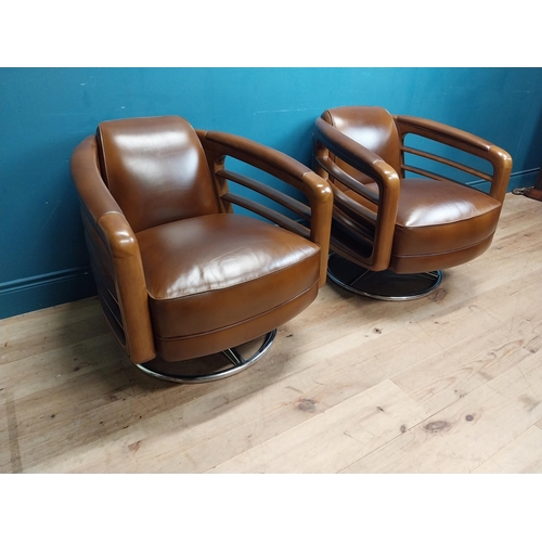 85 - Pair exceptional quality cherrywood and hand died leather swivel arm chairs on chrome bases in the M... 