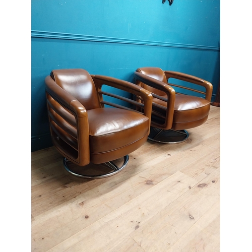 85 - Pair exceptional quality cherrywood and hand died leather swivel arm chairs on chrome bases in the M... 