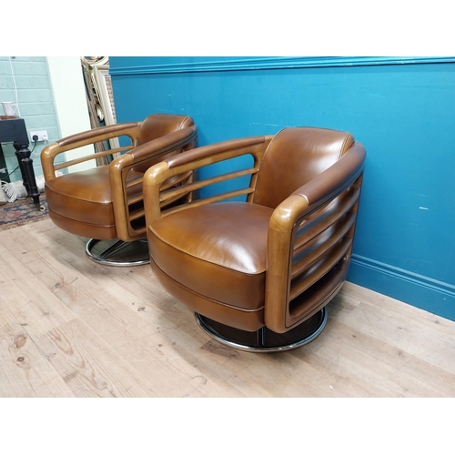 85 - Pair exceptional quality cherrywood and hand died leather swivel arm chairs on chrome bases in the M... 