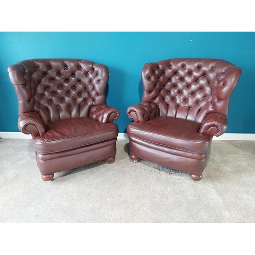 851 - Pair of deep buttoned leather wingback armchairs{109 cm H 98 cm W 76cm D}.