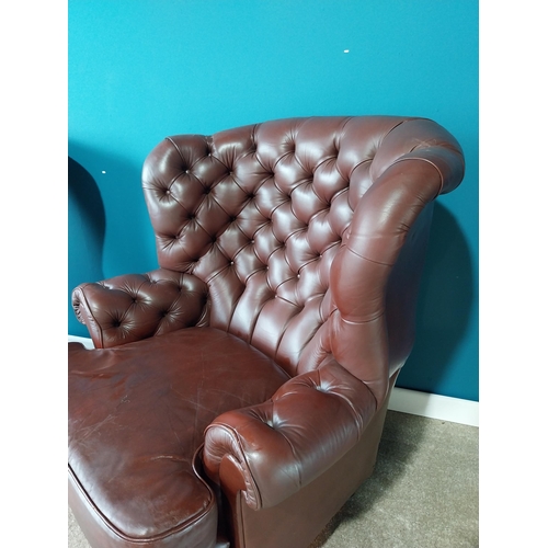 851 - Pair of deep buttoned leather wingback armchairs{109 cm H 98 cm W 76cm D}.