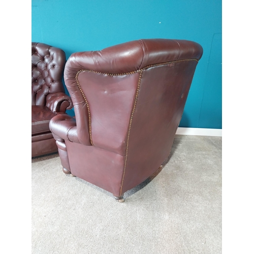 851 - Pair of deep buttoned leather wingback armchairs{109 cm H 98 cm W 76cm D}.