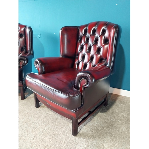 853 - Pair of deep buttoned leather wingback armchairs raised on square mahogany legs {102 cm H 82 cm W 80... 