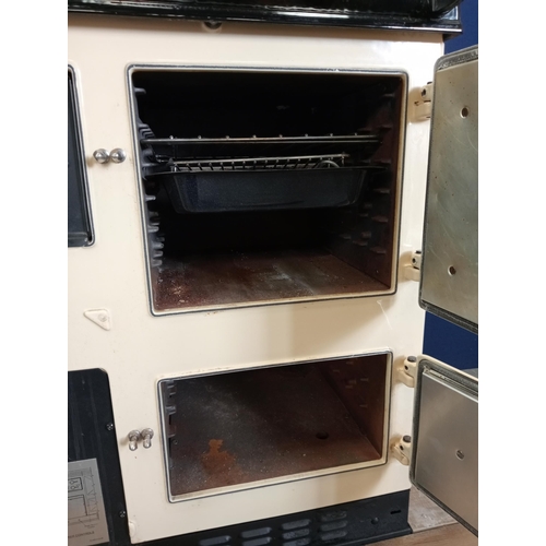 856 - Rayburn oil fired enamel two oven cooker { 105cm H X 90cm W X 65cm D }.