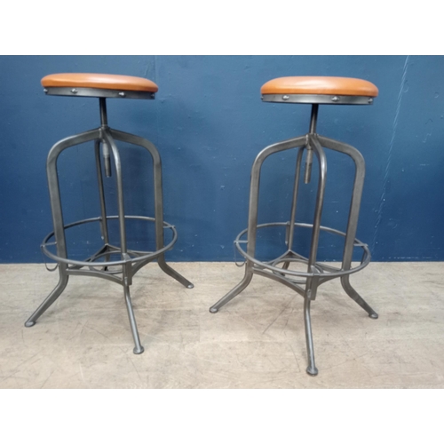 861 - Pair of metal swivel stools with leather upholstered seats. { 75cm H X 32cm Dia. }.