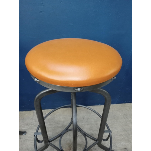 861 - Pair of metal swivel stools with leather upholstered seats. { 75cm H X 32cm Dia. }.