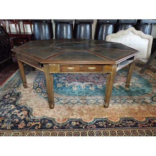 883 - 19th C. oak octagonal rent table with inset leather top raised on square reeded legs. Provenance fro... 