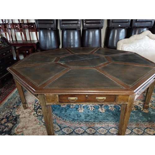 883 - 19th C. oak octagonal rent table with inset leather top raised on square reeded legs. Provenance fro... 