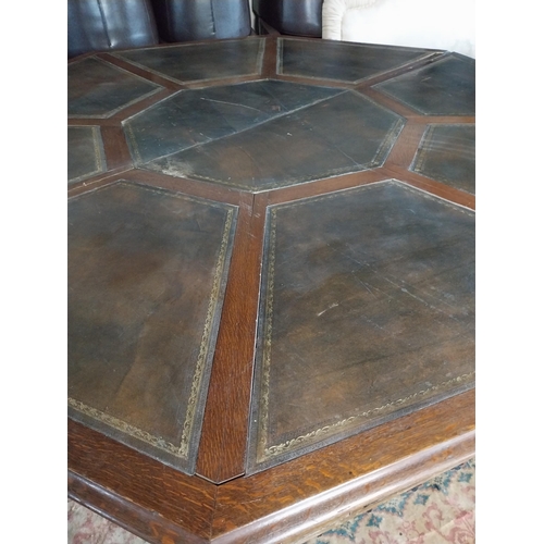 883 - 19th C. oak octagonal rent table with inset leather top raised on square reeded legs. Provenance fro... 