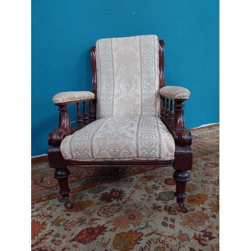 892 - 19th. C. Upholstered mahogany open armchair raised on tapered reeded legs, in need of some repairs {... 