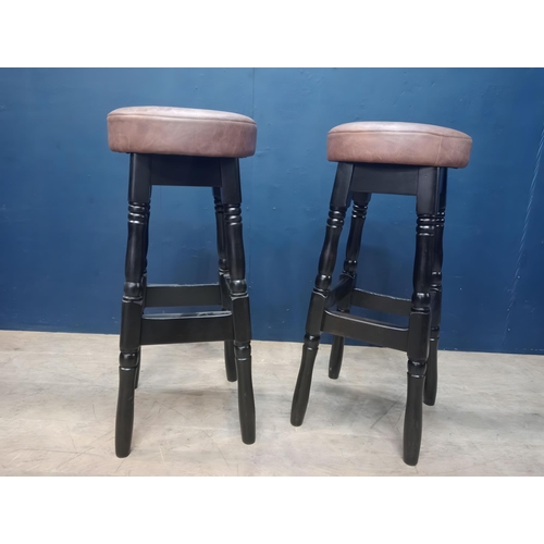 898 - Pair of  high stools with leather upholstered seats in the Tudor style. { 78cm H X 33cm Dia }.