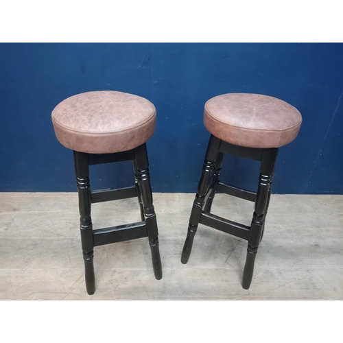 898 - Pair of  high stools with leather upholstered seats in the Tudor style. { 78cm H X 33cm Dia }.