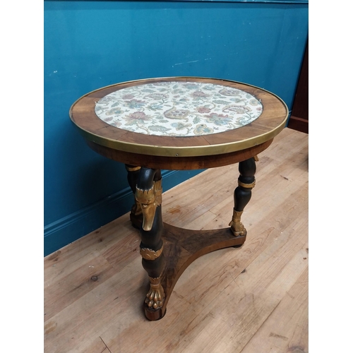 90 - Good quality gilt and ebonised walnut centre table with platform base on three carved legs in the Re... 