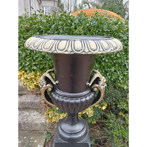 902 - Pair  of cast iron urns and bases  { Total 185cm H X 66cm Dia & Bases 93cm H X 53cm Sq. }.