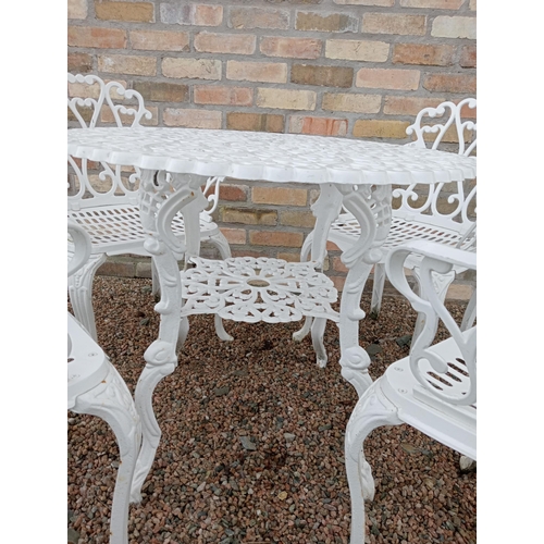 905 - Cast aluminium white garden table and four cast aluminium armchairs { Table 69cm H X 80cm Dia & Chai... 