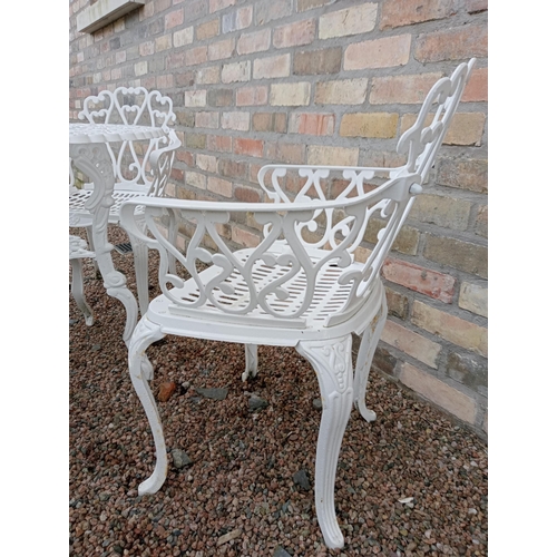 905 - Cast aluminium white garden table and four cast aluminium armchairs { Table 69cm H X 80cm Dia & Chai... 