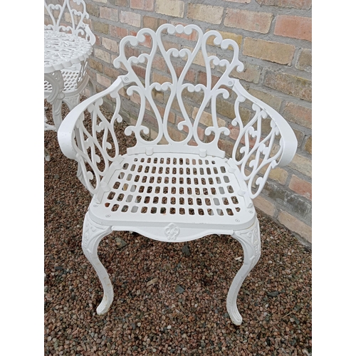 905 - Cast aluminium white garden table and four cast aluminium armchairs { Table 69cm H X 80cm Dia & Chai... 