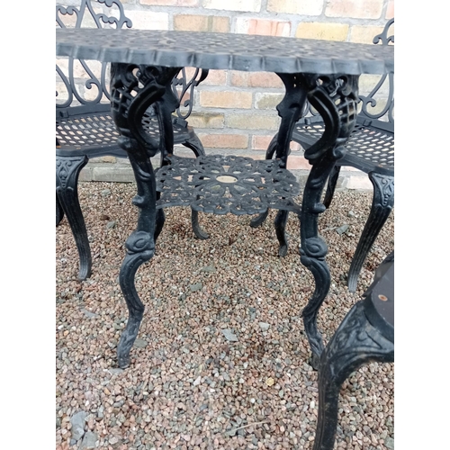 907 - Cast aluminium black garden table and four cast aluminium armchairs { Table 69cm H X 80cm Dia & Chai... 