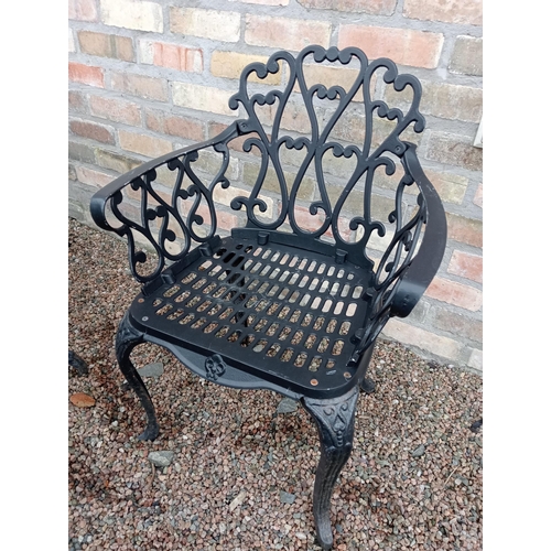 907 - Cast aluminium black garden table and four cast aluminium armchairs { Table 69cm H X 80cm Dia & Chai... 