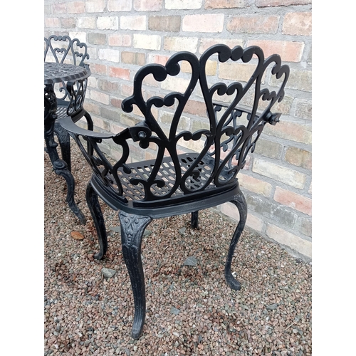 907 - Cast aluminium black garden table and four cast aluminium armchairs { Table 69cm H X 80cm Dia & Chai... 