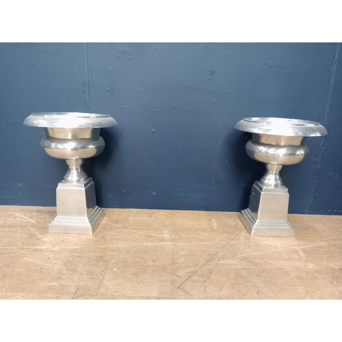 911 - Pair of 20th C chrome urns raised on stepped plinth base. { 43cm H X 32cm Dia }. }.