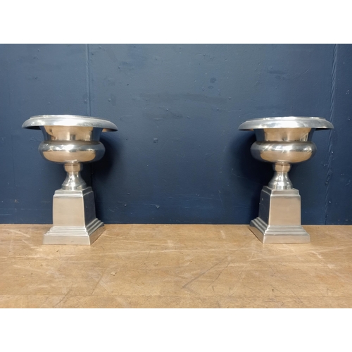 911 - Pair of 20th C chrome urns raised on stepped plinth base. { 43cm H X 32cm Dia }. }.