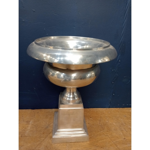 911 - Pair of 20th C chrome urns raised on stepped plinth base. { 43cm H X 32cm Dia }. }.